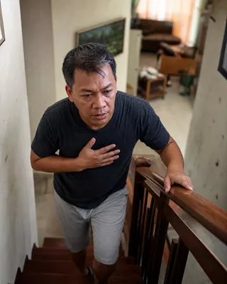 Man pausing on the stairs